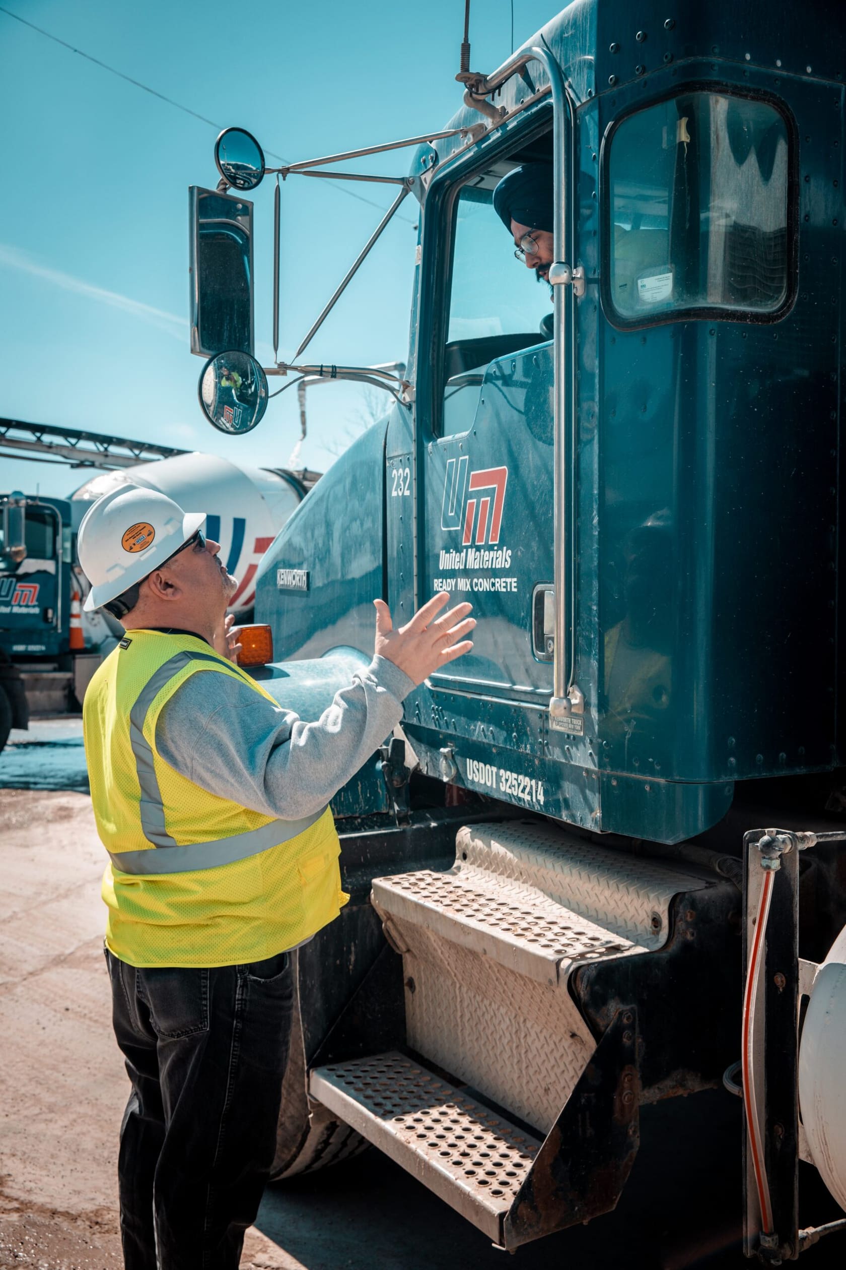 DiamondDrive - United Materials worker talking with a ready-mix driver at the truck cab door