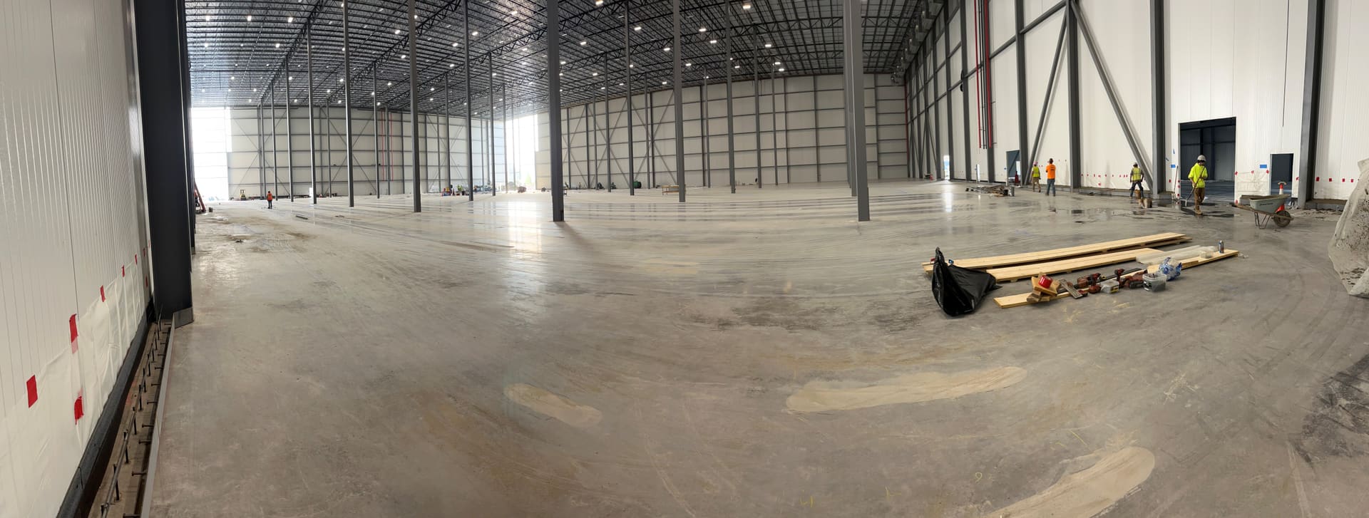 FiberMaxMI - panoramic view of a large commercial warehouse interior with a new concrete floor